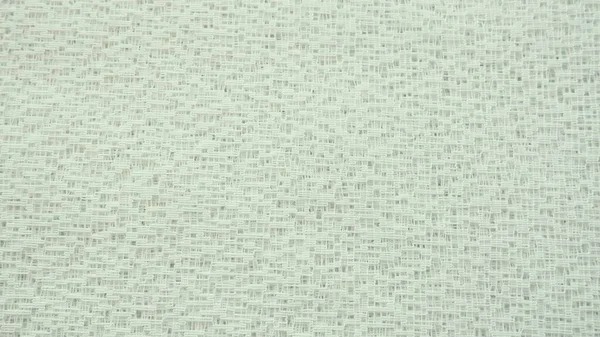 Sheer beige net-like tulle. Mesh fabric. Close-up. Veil or muslin of champagne or milky color. Close-up of a curtain with different sized holes. Abstract background — Stock Photo, Image