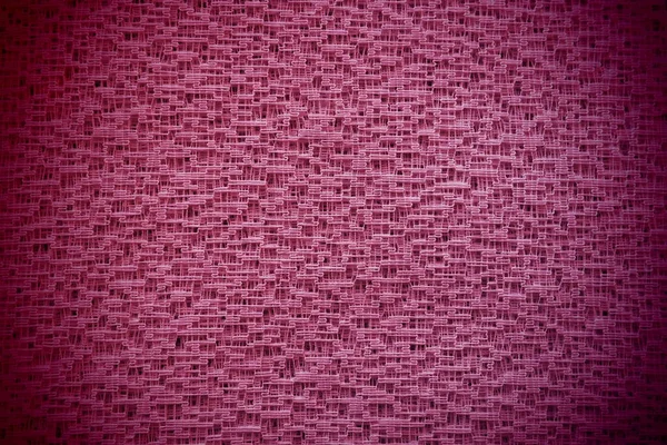 Sheer lilac or pink net-like tulle. Mesh fabric. Close-up. Veil or muslin. Close-up of a curtain with different sized holes. Abstract background. Dark vignetting around the edges — Stock Photo, Image