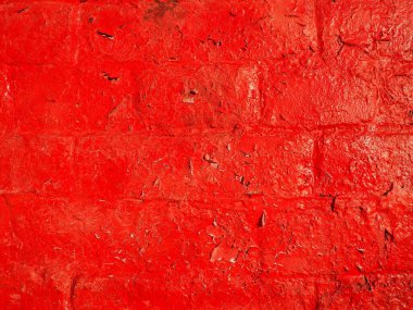 Red wall and texture background. Large bricks painted with glossy oil scarlet paint