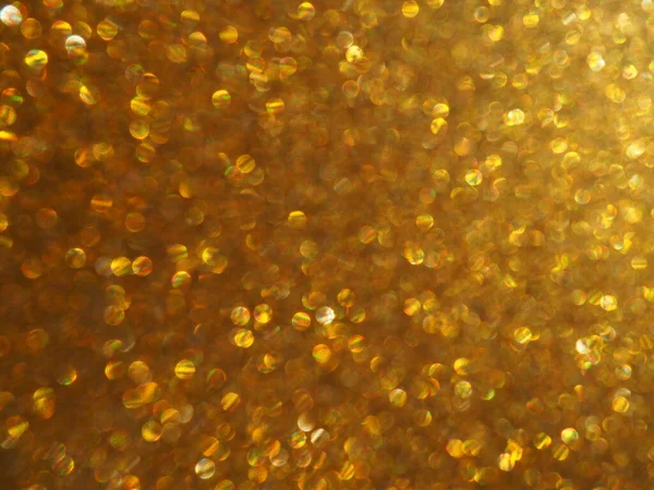 金の輝きのボケの光 金色の輝きの質感の背景 スパンコールと輝きの輝くキラキラ包装紙 祭りの黄金のボケと輝き 美しいマクロ背景 — ストック写真
