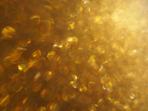 金の輝きのボケの光 金色の輝きの質感の背景 スパンコールと輝きの輝くキラキラ包装紙 祭りの黄金のボケと輝き 美しいマクロ背景 — ストック写真