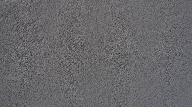 Gri arka plan. Alçıyla kaplanmış gri ya da siyah duvar. Sert bir doku. Kadife etkisi. Duvarların, iç mekanların, binaların ve binaların ön cephelerinin profesyonelce bitirilmesi. İnşaat ve tasarım.