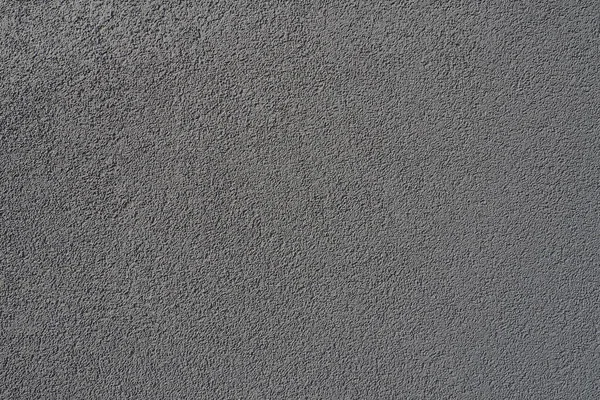 Gri arka plan. Alçıyla kaplanmış gri ya da siyah duvar. Sert bir doku. Kadife etkisi. Duvarların, iç mekanların, binaların ve binaların ön cephelerinin profesyonelce bitirilmesi. İnşaat ve tasarım.