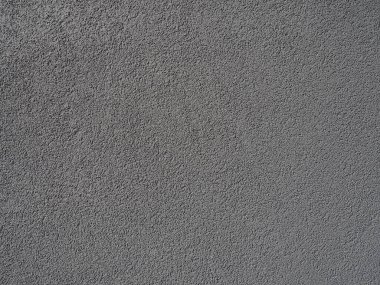 Gri arka plan. Alçıyla kaplanmış gri ya da siyah duvar. Sert bir doku. Kadife etkisi. Duvarların, iç mekanların, binaların ve binaların ön cephelerinin profesyonelce bitirilmesi. İnşaat ve tasarım.