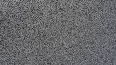 Gri arka plan. Alçıyla kaplanmış gri ya da siyah duvar. Sert bir doku. Kadife etkisi. Duvarların, iç mekanların, binaların ve binaların ön cephelerinin profesyonelce bitirilmesi. İnşaat ve tasarım