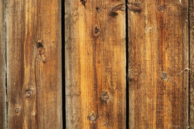 Tahtayı doğal dokuyla kapat. Boş tahta şablon tahtası üst görünüm ürün görüntüsü veya montaj için bir zemin olarak kullanılabilir. Yüksek kalite fotoğraf. Düğümsüz dikey kahverengi panolar.