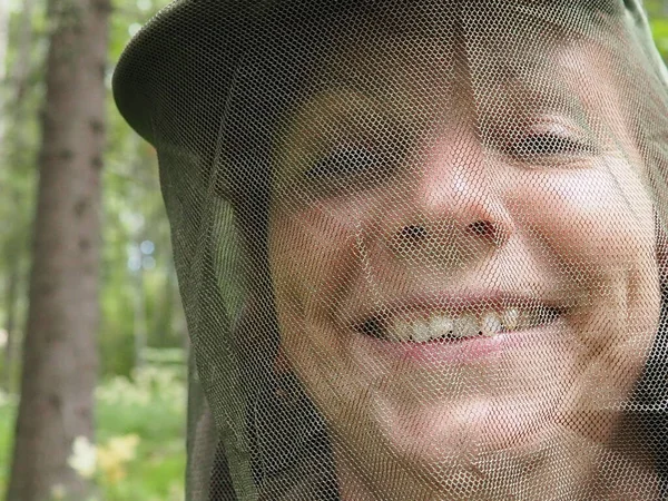 Woman Her 40S Wearing Mosquito Headdress Smiles Looks Camera Cap — Stockfoto