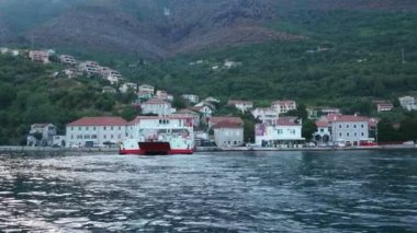 Boka Kotor Adriatic Sea, Verige Strait Kamenari Lepetane Ferry Line Trajekt. Ferryboat for passenger, cargo and vehicles. Tourism and business in Montenegro Maritime transport coastal. August 16 2022