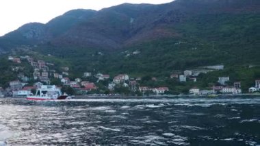 Boka Kotor Adriatic Sea, Verige Strait Kamenari Lepetane Ferry Line Trajekt. Ferryboat for passenger, cargo and vehicles. Tourism and business in Montenegro Maritime transport coastal. August 16 2022