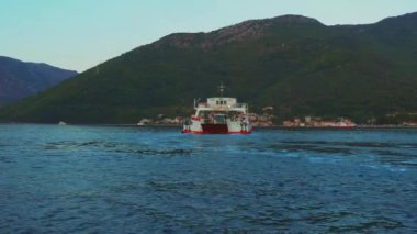 Boka Kotor Adriatic Sea, Verige Strait Kamenari Lepetane Ferry Line Trajekt. Ferryboat for passenger, cargo and vehicles. Tourism and business in Montenegro Maritime transport coastal. August 16 2022