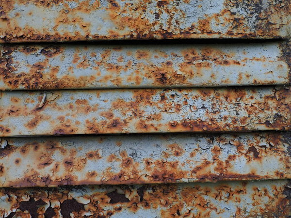 A closeup shot of a rusty metal surface. Corosion.