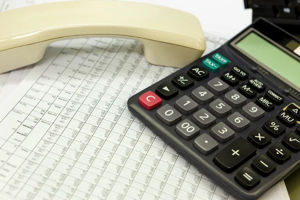 Business report with phone and calculator — Stock Photo, Image