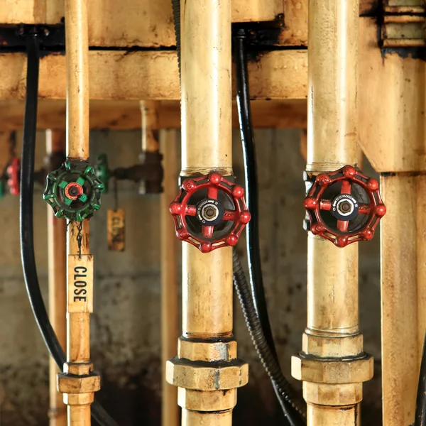 Pipes and faucet valves of oil system — Stock Photo, Image