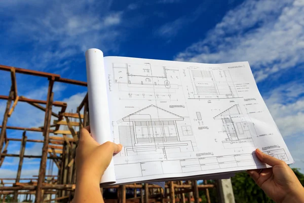 Architecture drawings in hand — Stock Photo, Image