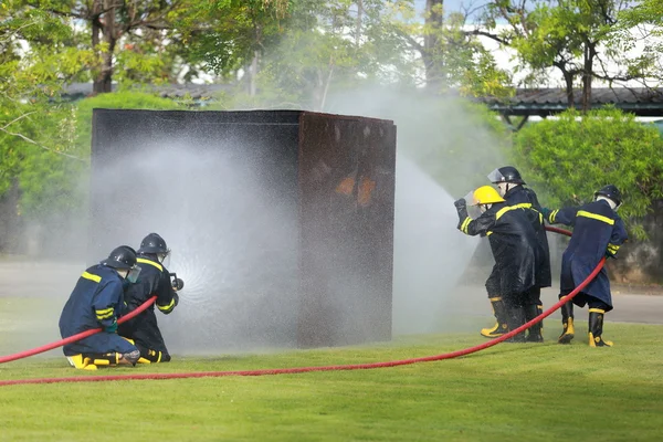 Firefighter fighting for fire attack training — Stock Photo, Image