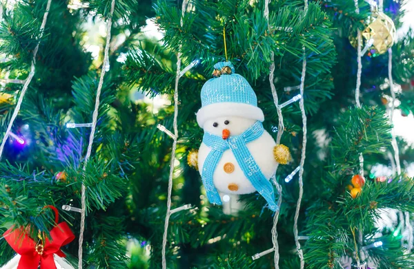 Christmas toy on green pine tree — Stock Photo, Image