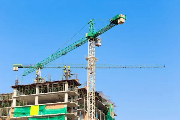 Construction site with crane and workers — Stock Photo, Image