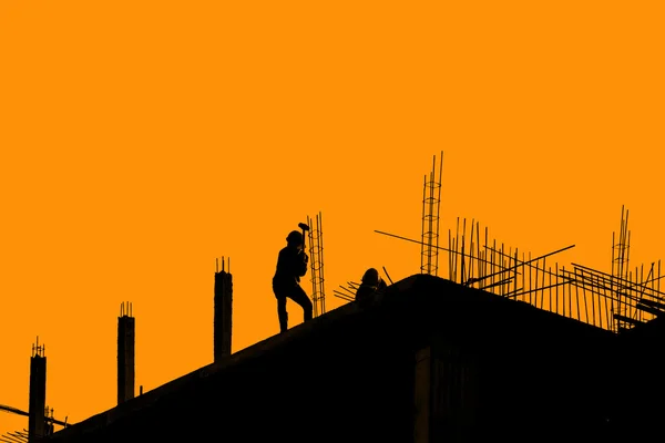 Silhouette labor working in construction site — Stock Photo, Image