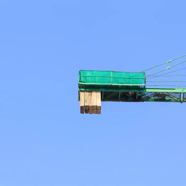 Construction site with cranes on blue sky background — Stock Photo, Image