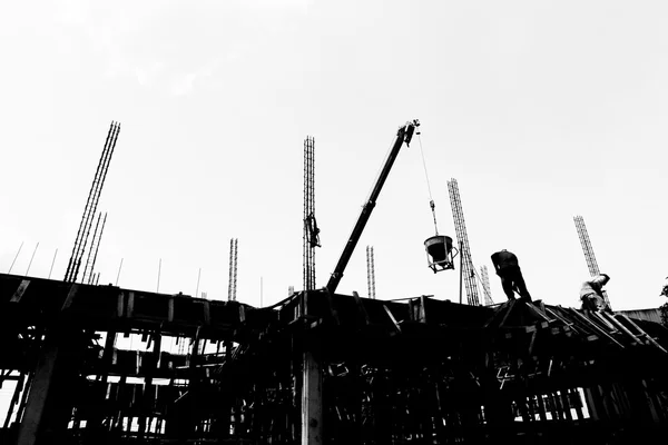 Silhouette labor working in construction site — Stock Photo, Image