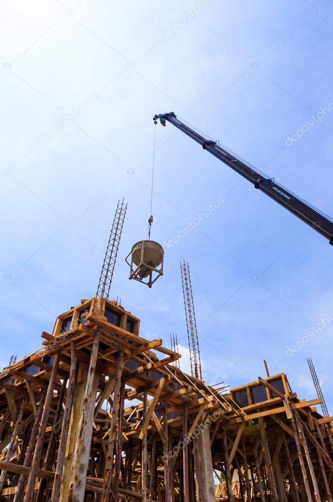 Crane working in construction on blue sky 