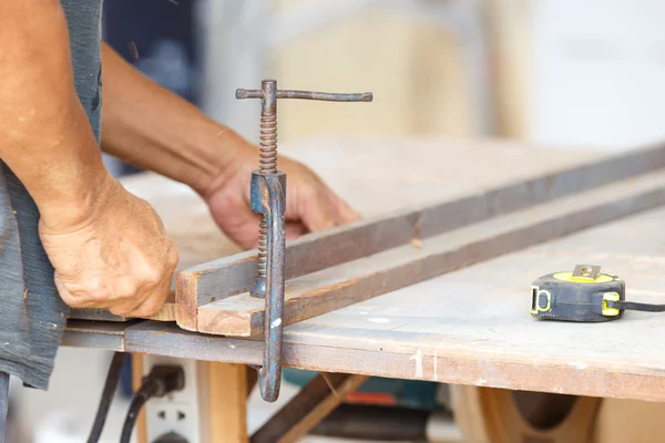 Carpenter cut wood for house construction — Stock Image Carpenter cut wood for house construction Stock Photo