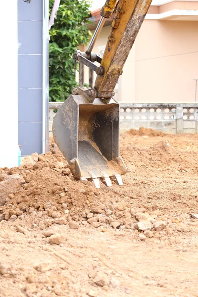 Graafmachine emmer op de bouwplaats — Stockfoto