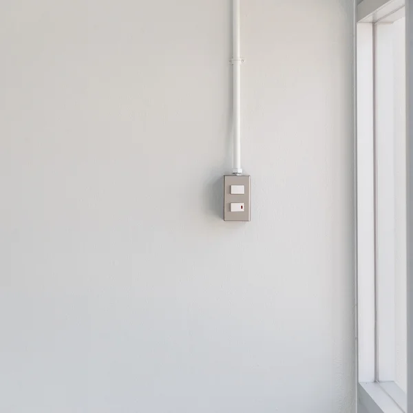 Switch light on white wall — Stock Photo, Image