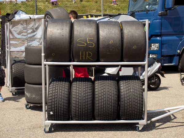 Race tyres are stalled behind the pitlane — Stock Photo, Image