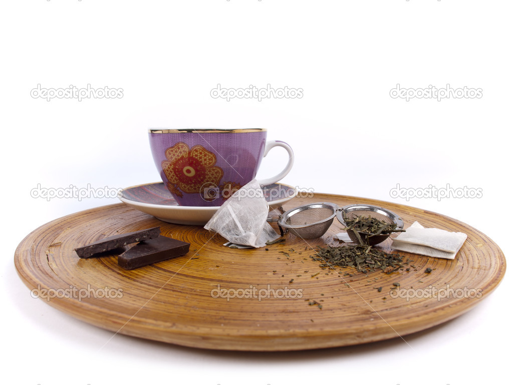 Cup of tea with chocolate and different kinds of fresh tea