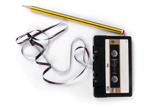 Retro cassette with loose tape over a white background — Stock Photo, Image