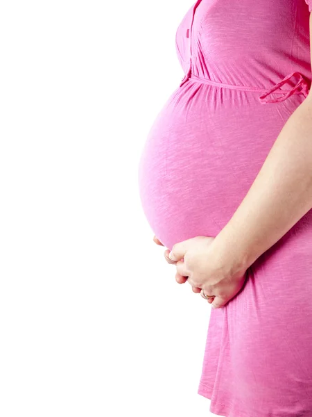 36 Wochen schwangere junge Frau in rosa hält ihren Bauch — Stockfoto