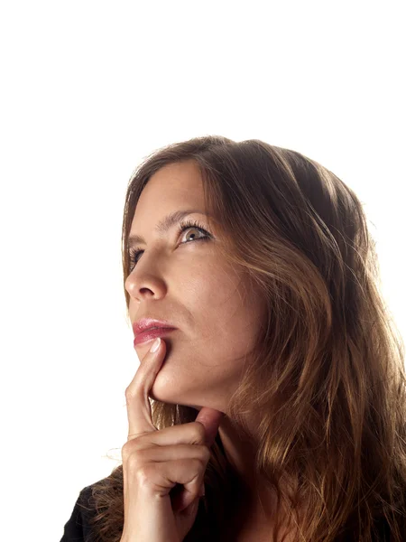 Beautiful brunette looking up wondering about something — Stock Photo, Image