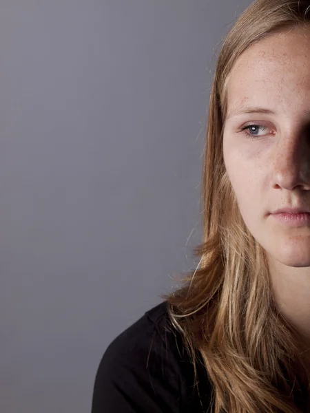 Young teenage girl looking sad or depressed — Stock Photo, Image