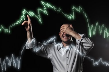 Scared trader pointing to stock market charts clipart