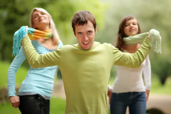 Young man playing with two girls. — Stock Photo, Image