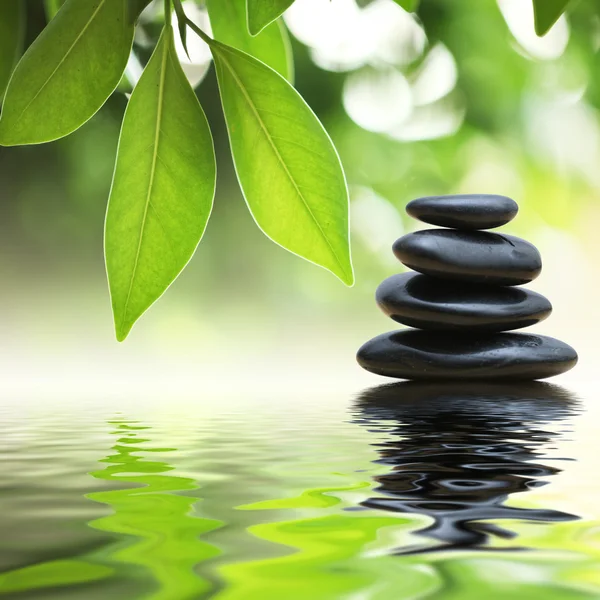 Zen stones pyramid on water surface — Stock Photo, Image