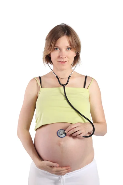 Femme enceinte utilisant le stéthoscope — Photo