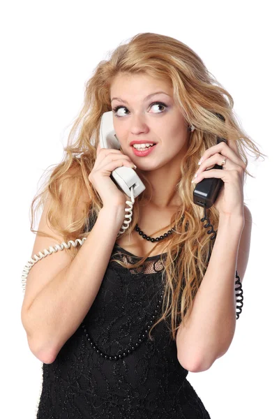 Woman talking on two phones — Stock Photo, Image