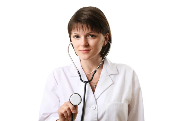 Female doctor holding stethoscope pointed toward camera. — Stock Photo, Image