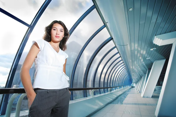 Businesswoman in futuristic interior — Stock Photo, Image