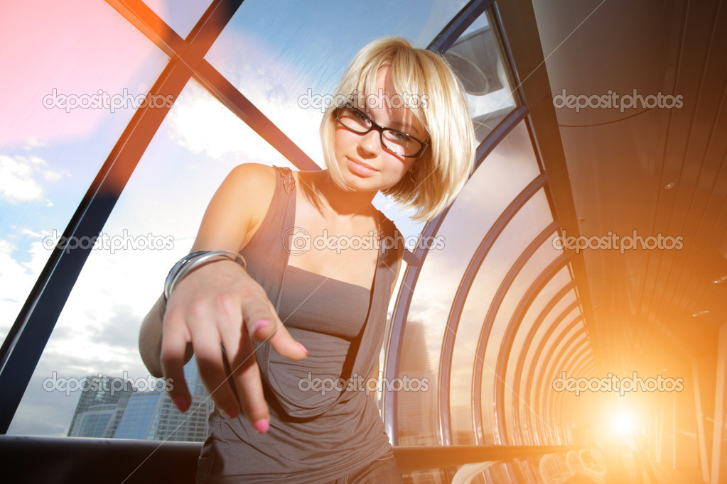 Young businesswoman pointing in camera