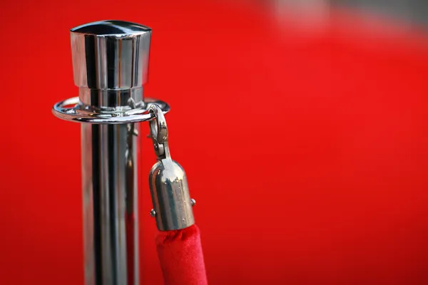 Red security rope by red carpet — Stock Photo, Image