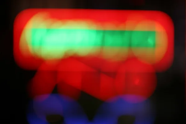Defocused neon skylt bakgrund — Stockfoto