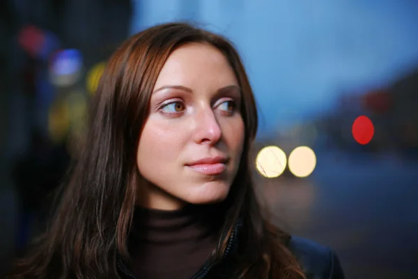 Beautiful young woman at dusk — Stock Photo, Image