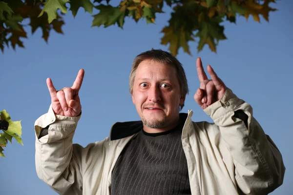 Mature man throwing the goat — Stock Photo, Image