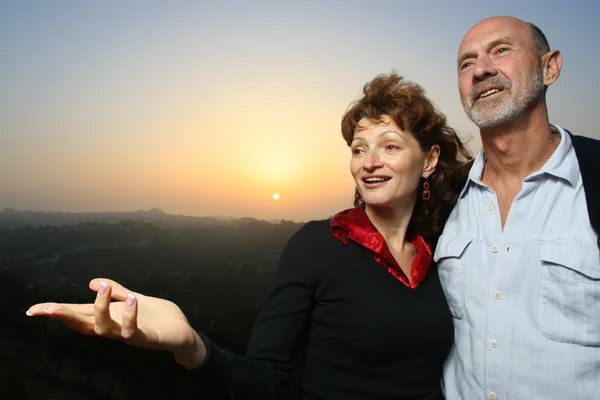 Happy couple outdoors at sunset — Stock Photo, Image