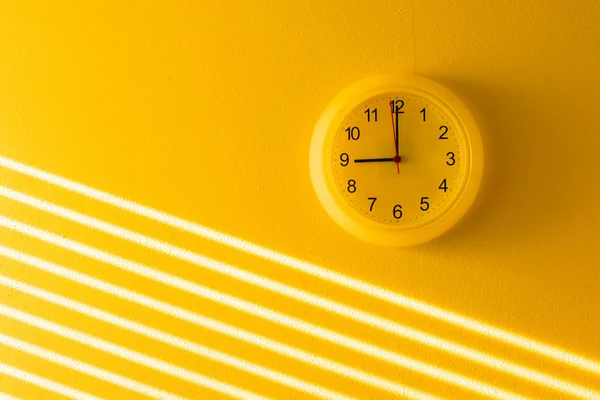 Yellow wall & clock — Stock Photo, Image