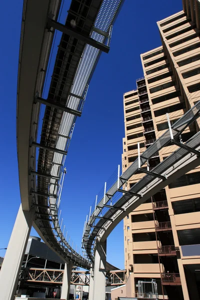 Futuristic monorail going around skyscrapers — Stock Photo, Image