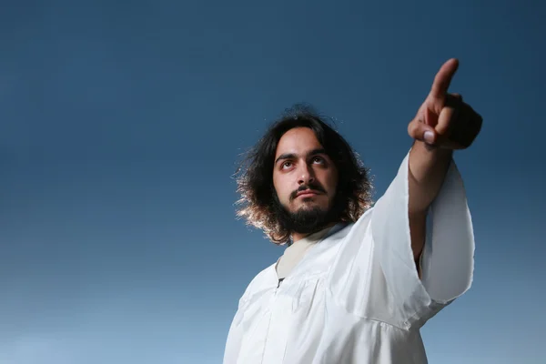 Man looking like Jesus pointing his finger — Stock Photo, Image